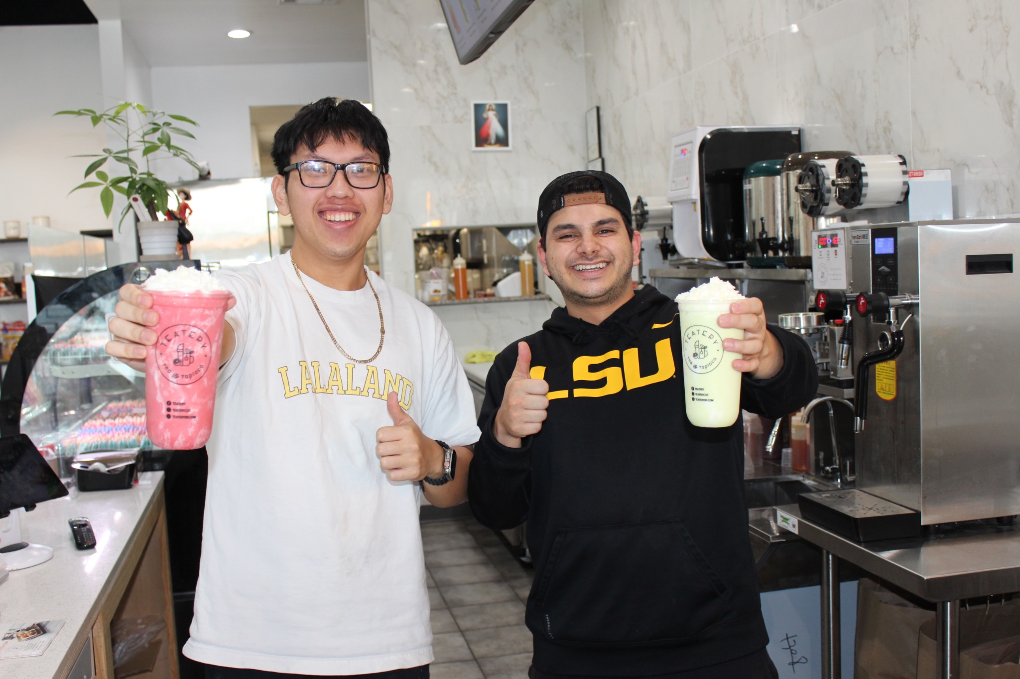 Two Teatery team members behind the counter